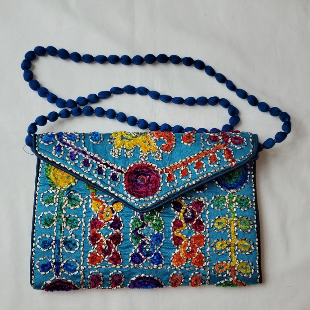 Decorative colorful embroidered clutch